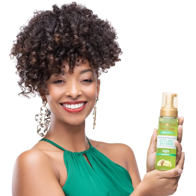 Creme of Nature Pure Honey Hair Food smoothing and frizz control styling mousse in 207ml bottle, with a pump dispenser.